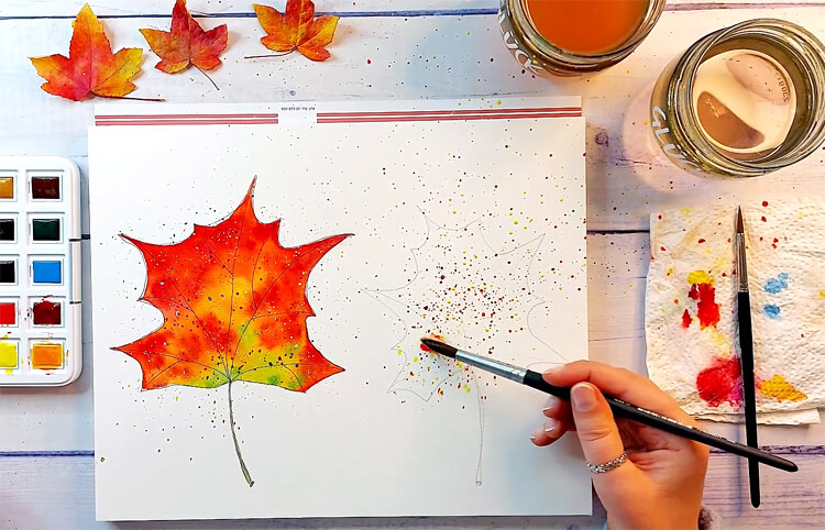 Aquarell-Herbstblatt aus Farbsprenkeln