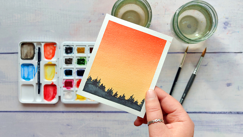 kleine Aquarell-Landschaft mit rötlichem Abendhimmel, Tannen