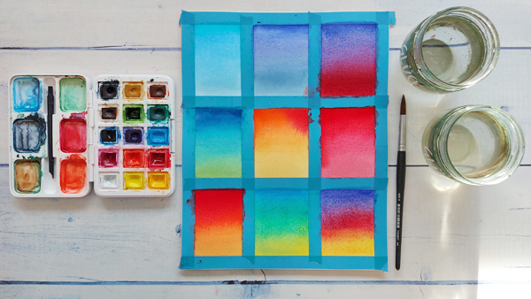 Aquarellpapier mit neuen abgeklebten und bunt bemalten Flächen