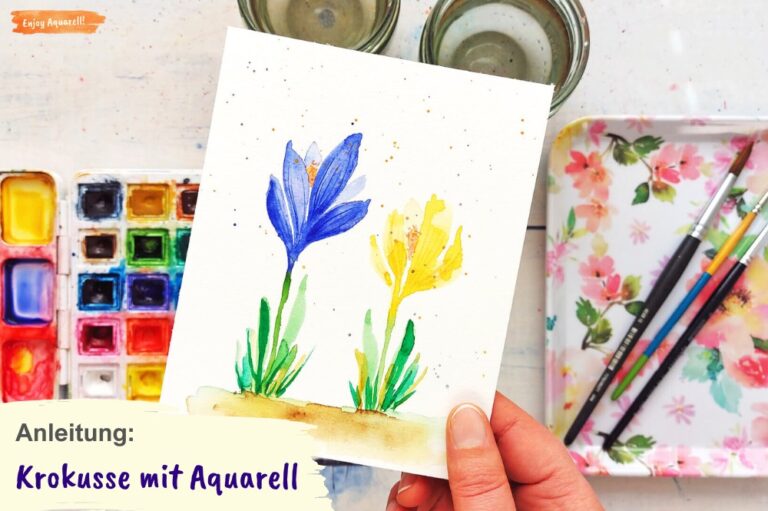 Hand hält Bild mit zwei Krokussen gemalt mit Aquarellfarben