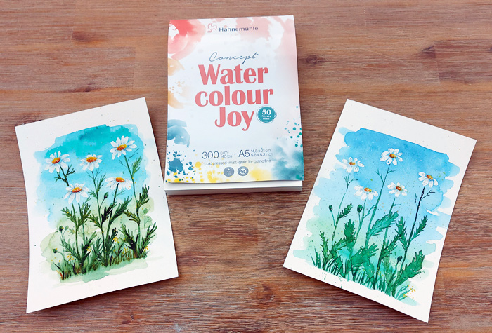 zwei Aquarellbilder mit Kamille-Blumen vor blauem Himmel