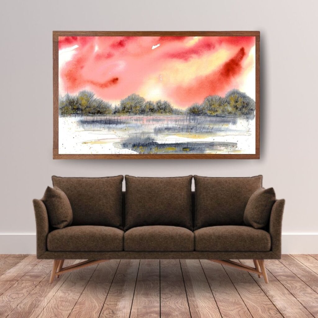 Aquarellbild halb abstrakt mit intensiv rotem Himmel und schlichter Landschaft über braunem Sofa